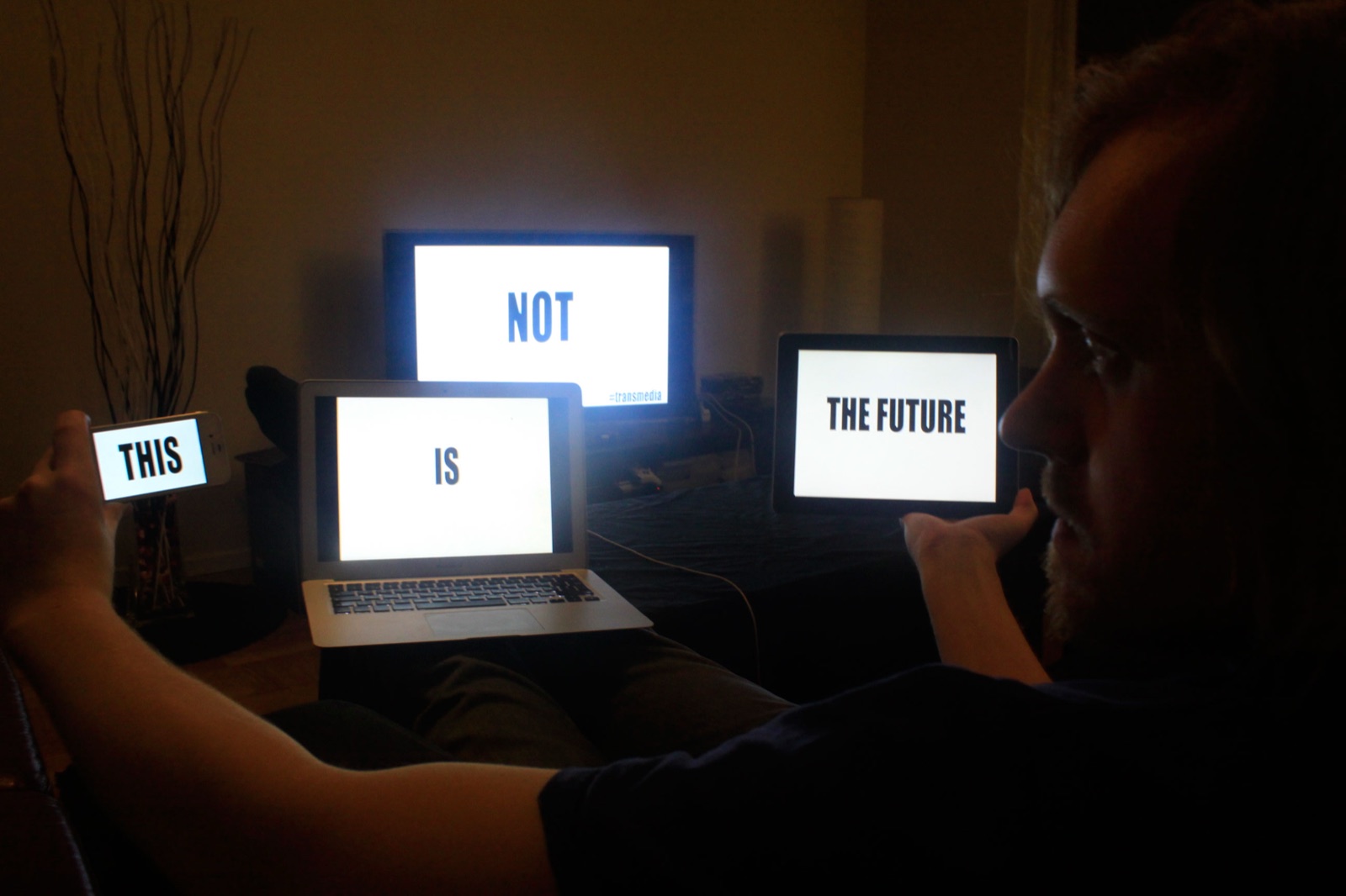 Four screens spelling: this is not the future — transmedia
